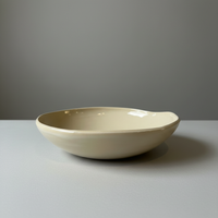Beige ceramic bowl studio shot